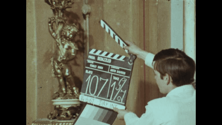 On set with a clapperboard